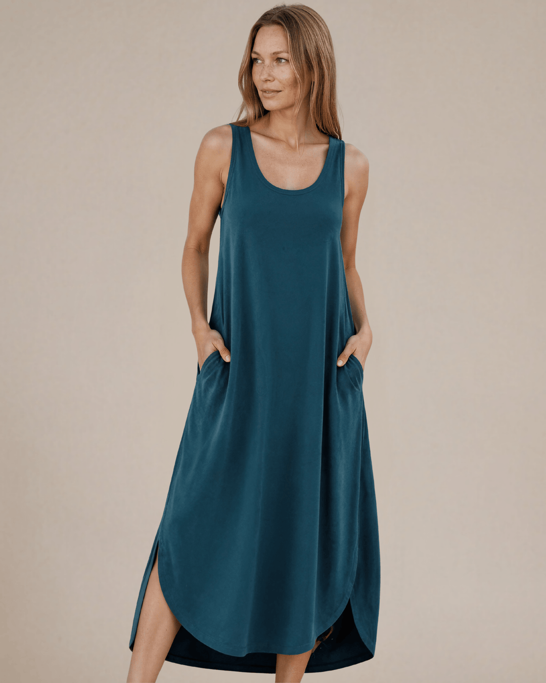 Shop the Sammie Sleeveless Maxi Dress in teal. Relaxed fit, scoop neck, side pockets & slits. 95% Rayon, 5% Spandex. Made in USA. Free shipping may apply.