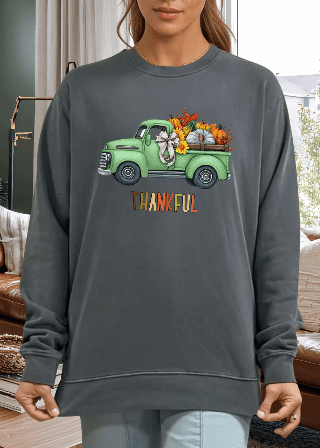 Cozy up in gratitude with this heavyweight pigment-dyed cotton sweatshirt featuring a charming vintage green truck graphic and the colorful word "Thankful". Crafted in the USA from 100% cotton, this piece delivers the durability and comfort you'll love wearing season after season.