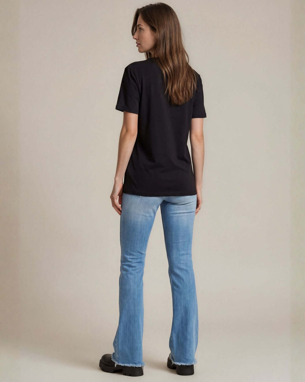The True American Women's T-Shirt: Super soft 100% combed ring-spun cotton V-neck tee in black, made in the USA with USA-milled fabric. Flattering fit, effortless style.
