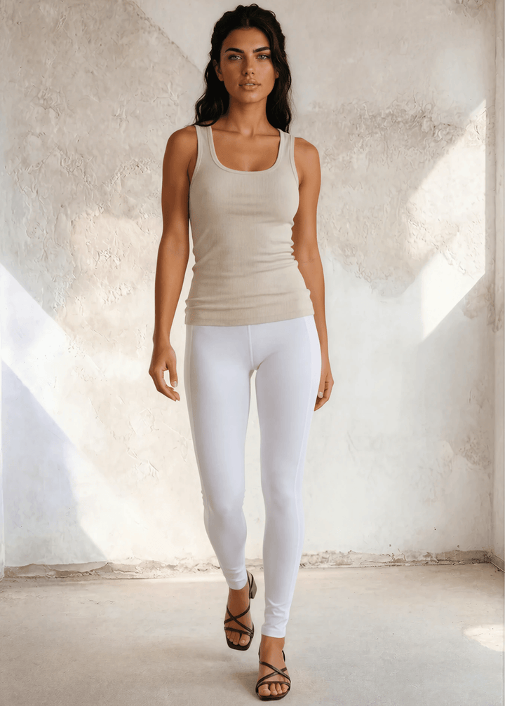 The Bra30 Tummy Tucker is an extra-long extra supportive racerback tank top that comfortably helps smooth out those unwanted lumps and bumps.  Egg Nog Cream Color , Made in USA