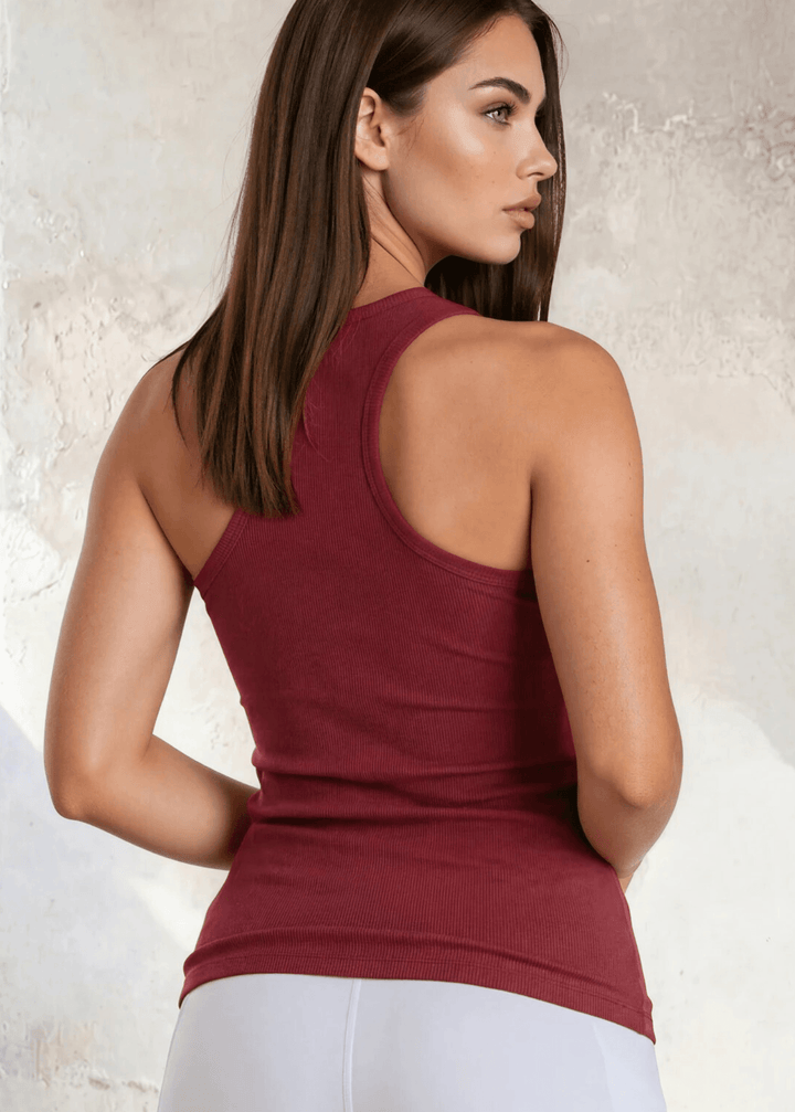 The Bra30 Tummy Tucker is an extra-long extra supportive racerback tank top that comfortably helps smooth out those unwanted lumps and bumps.  Dark Red Color , Made in USA