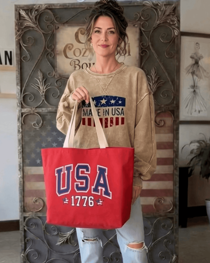 Made in USA. Carry a USA 1776 canvas tote with American Made artwork on the reverse. 12 oz. USA cotton canvas, 20" x 14.5" x 4.5", in Red or Natural.