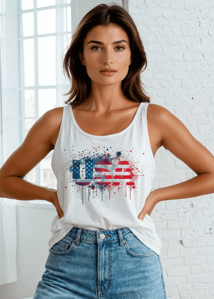 Celebrate your patriotic spirit in this eye-catching Paint Splatter USA American Flag Tank. Crafted from soft, breathable 95% cotton and 5% spandex blend.  Made right here in the USA with American cotton, this versatile tank delivers comfort and style with every wear