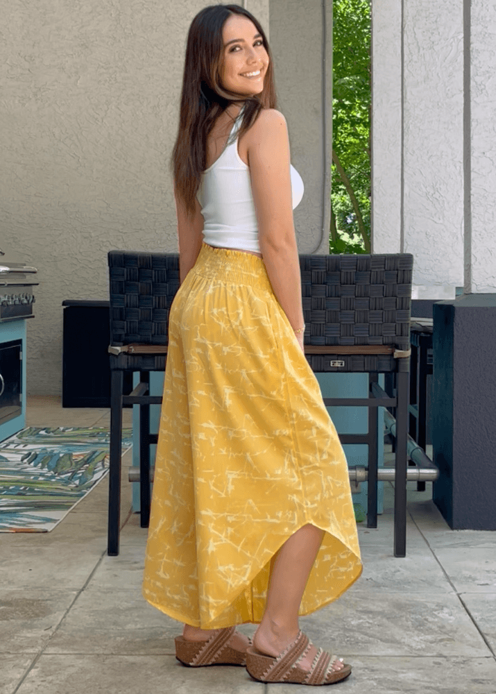 Made in USA Women's Fun Yellow Printed Smocked Waist Pants with Pockets and Asymmetrical Cropped Hem | Brand: Bucket List Style P5024  | Made in USA 