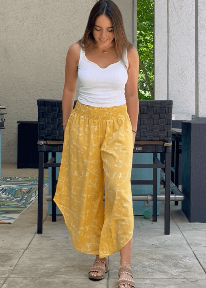 Made in USA Women's Fun Yellow Printed Smocked Waist Pants with Pockets and Asymmetrical Cropped Hem | Brand: Bucket List Style P5024  | Made in USA 