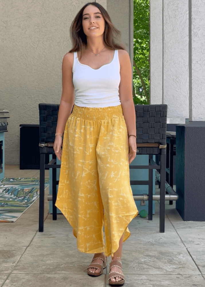 Made in USA Women's Fun Yellow Printed Smocked Waist Pants with Pockets and Asymmetrical Cropped Hem | Brand: Bucket List Style P5024  | Made in USA 