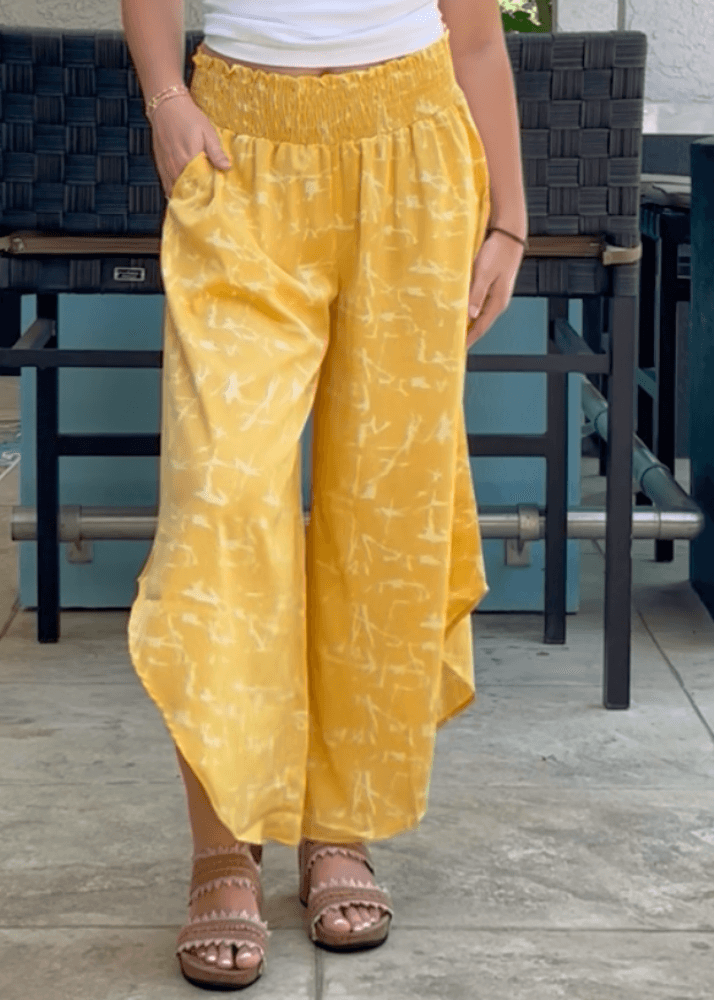Made in USA Women's Fun Yellow Printed Smocked Waist Pants with Pockets and Asymmetrical Cropped Hem | Brand: Bucket List Style P5024  | Made in USA 