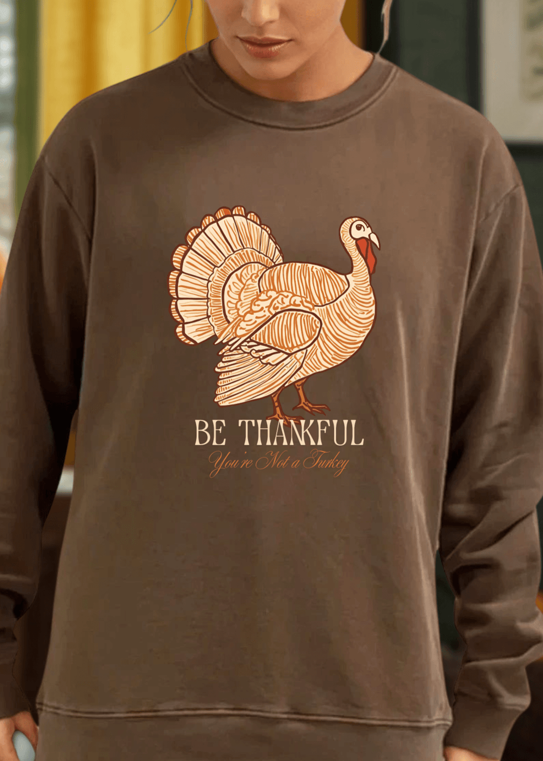 Stay cozy and stylish this Thanksgiving with the Made in USA Be Thankful Turkey Graphic Heavy Cotton Fleece Sweatshirt. Crafted from 100% heavyweight USA cotton in Mocha