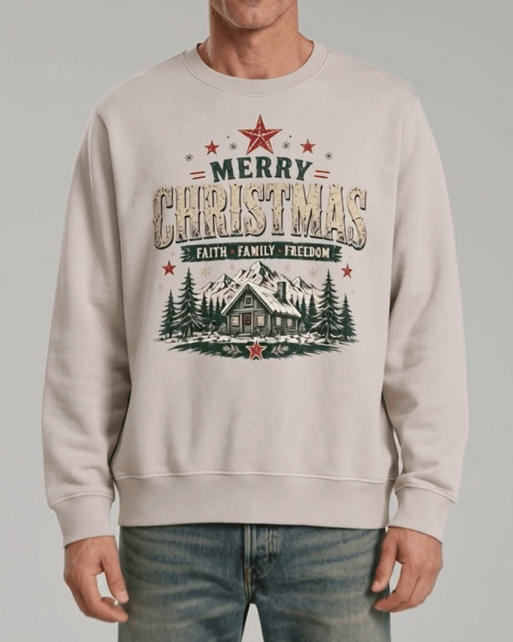 Made in USA Faith Family Freedom Christmas Cabin crew neck sweatshirt in beige with a Merry Christmas Faith Family Freedom log cabin graphic, front view on male model with jeans