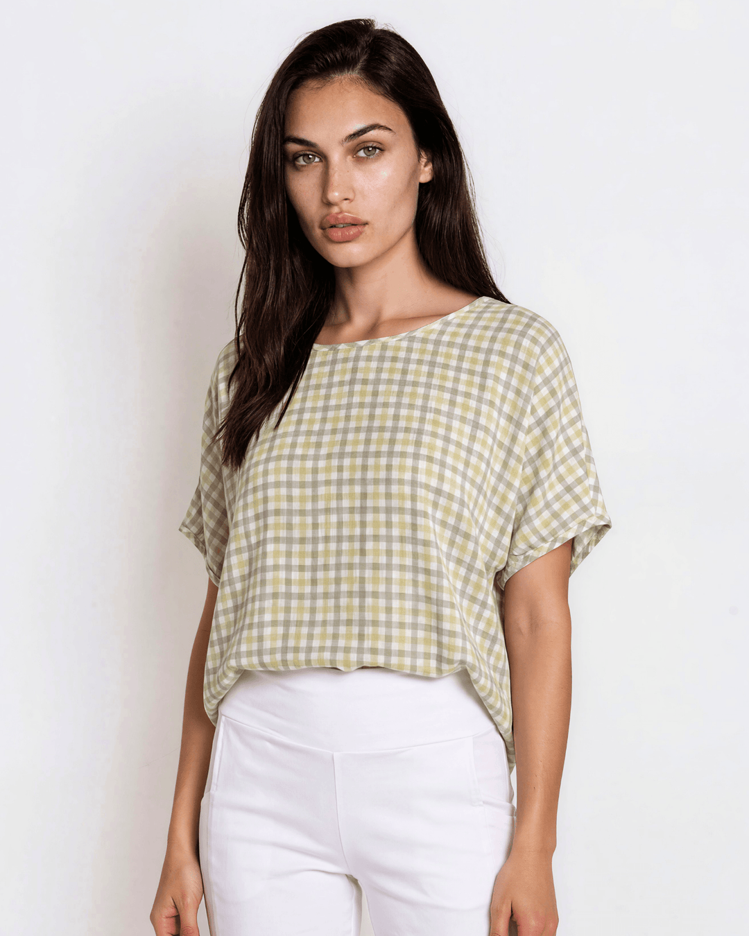Sage green woven checkered plaid short sleeve top with a wide scoop neckline, rolled cuffs, and a relaxed boxy fit in lightweight 100% rayon. Made in USA.