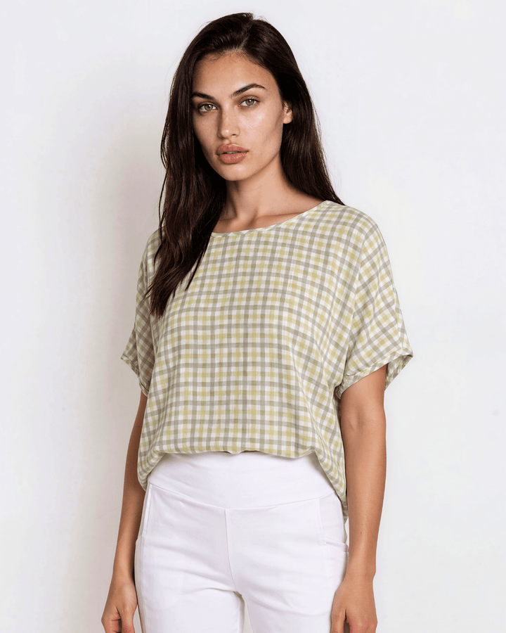 Sage green woven checkered plaid short sleeve top with a wide scoop neckline, rolled cuffs, and a relaxed boxy fit in lightweight 100% rayon. Made in USA.