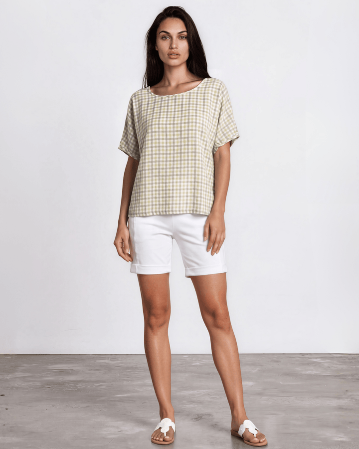 Sage green woven checkered plaid short sleeve top with a wide scoop neckline, rolled cuffs, and a relaxed boxy fit in lightweight 100% rayon. Made in USA.