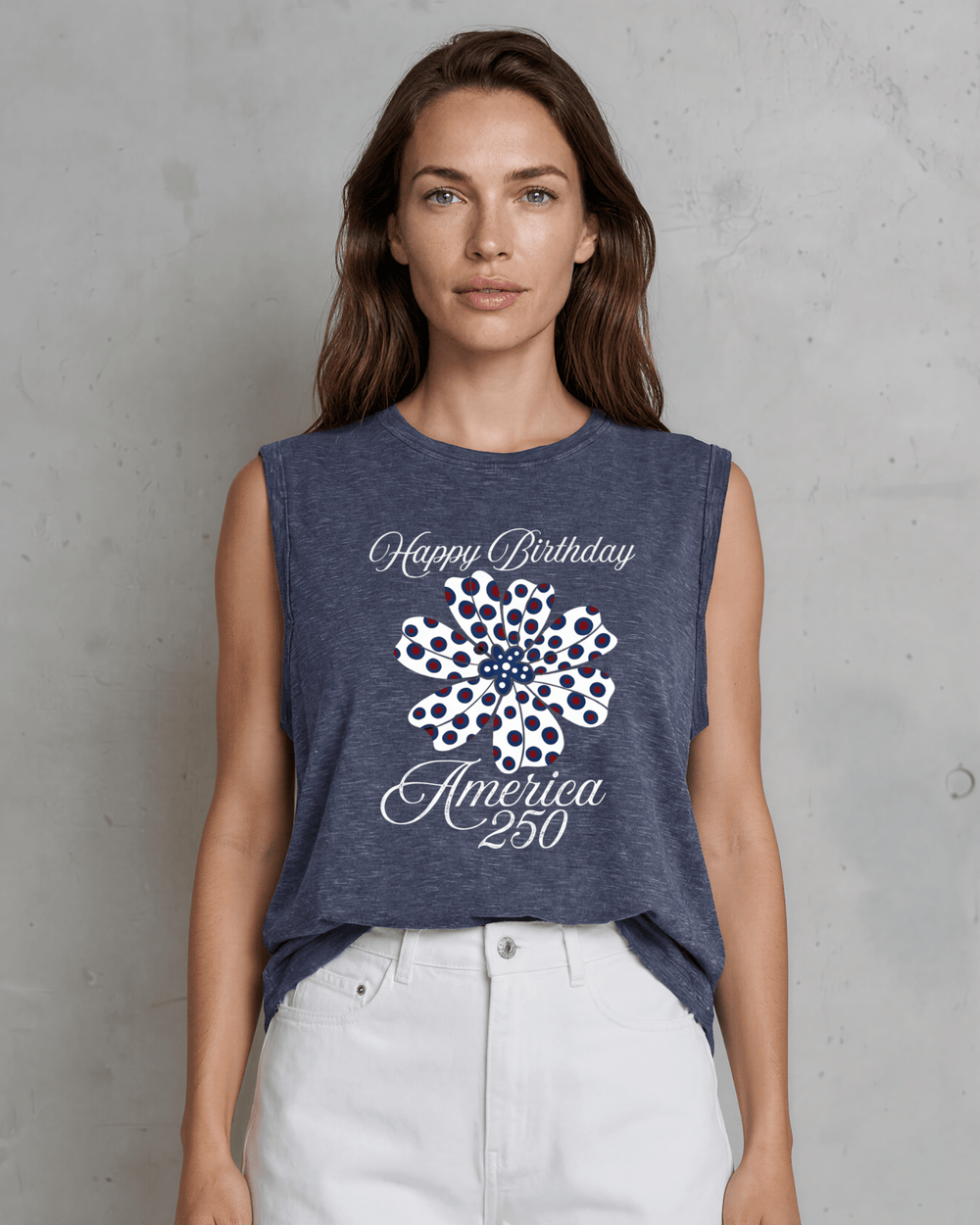 Celebrate America's 250th with this women's relaxed fit patriotic floral graphic muscle tee. Breathable cotton blend, rolled sleeves, navy, made in the USA.