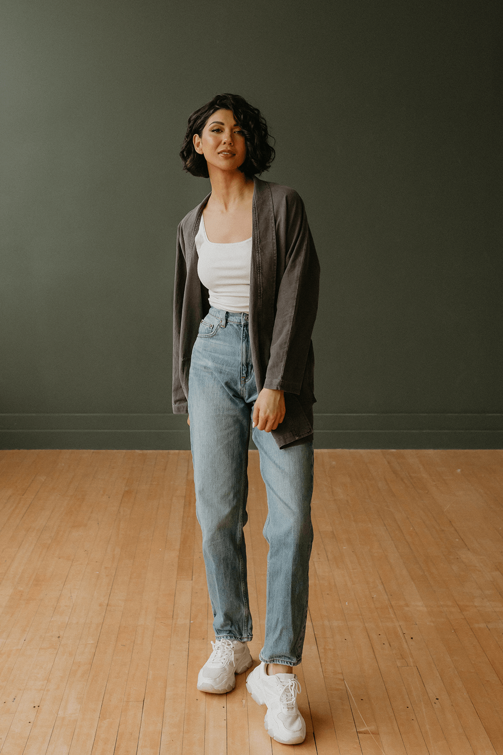 The Joni is our most stylish, fluid easy look cardigan. Knitted from 100% Organic Cotton, open front, long sleeve with two front pockets for comfort. Pair with our Perfect Tee, throw on a pair of jeans and you are ready to hit the city. + Vintage Black/ Sand Stone/ Desert Rose+ Machine wash cold/warm+ Tumble dry on low+ Available in S/M or L/XL 100% Organic Cotton Ethically made in Los Angeles, CA