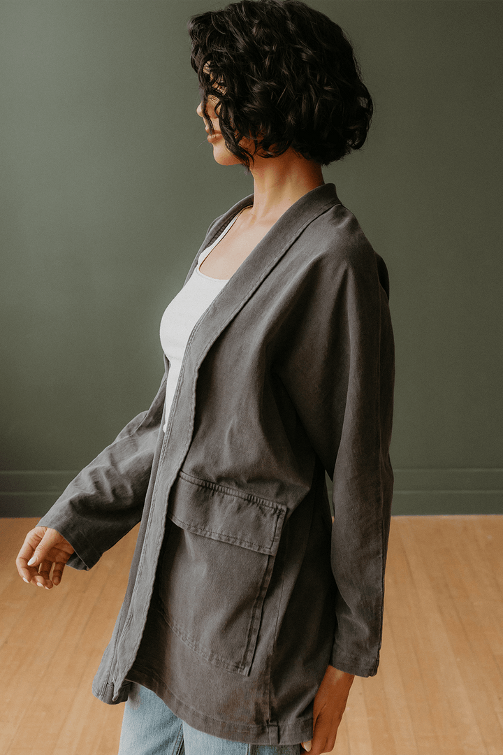 The Joni is our most stylish, fluid easy look cardigan. Knitted from 100% Organic Cotton, open front, long sleeve with two front pockets for comfort. Pair with our Perfect Tee, throw on a pair of jeans and you are ready to hit the city. + Vintage Black/ Sand Stone/ Desert Rose+ Machine wash cold/warm+ Tumble dry on low+ Available in S/M or L/XL 100% Organic Cotton Ethically made in Los Angeles, CA