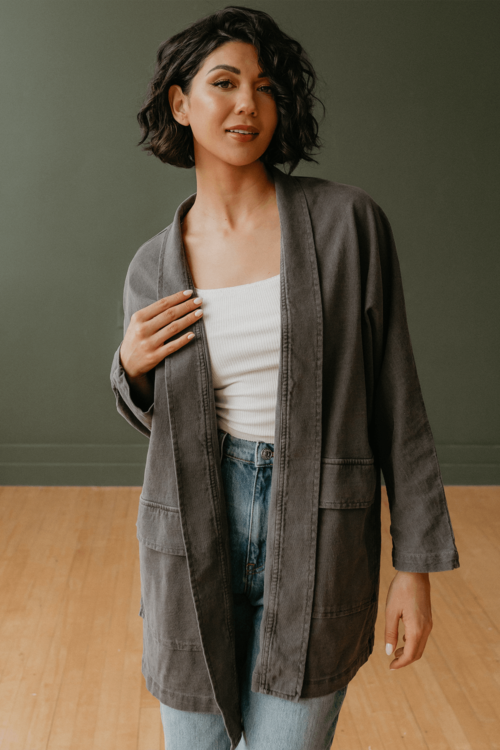 The Joni is our most stylish, fluid easy look cardigan. Knitted from 100% Organic Cotton, open front, long sleeve with two front pockets for comfort. Pair with our Perfect Tee, throw on a pair of jeans and you are ready to hit the city. + Vintage Black/ Sand Stone/ Desert Rose+ Machine wash cold/warm+ Tumble dry on low+ Available in S/M or L/XL 100% Organic Cotton Ethically made in Los Angeles, CA