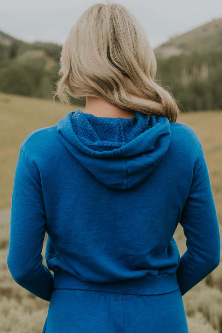 This vintage inspired cropped hoodie is made from light-weight 100% organic cotton. Wear this on a cozy coffee date on an overcast day or a movie night in with friends.  100% Organic Cotton Made in USA