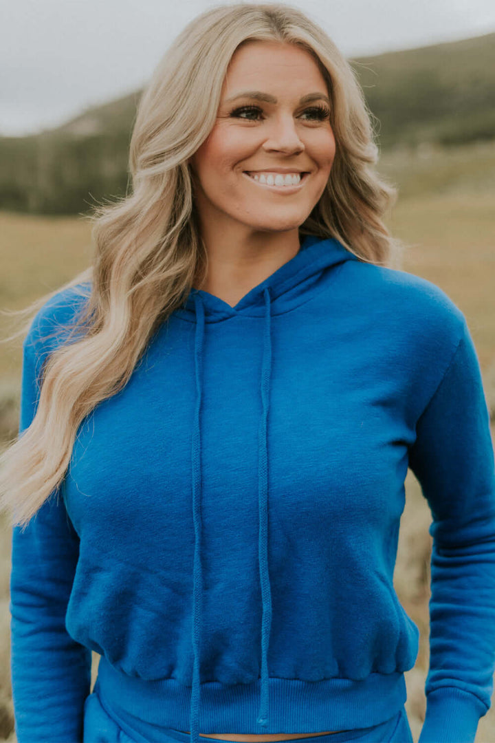 This vintage inspired cropped hoodie is made from light-weight 100% organic cotton. Wear this on a cozy coffee date on an overcast day or a movie night in with friends.  100% Organic Cotton Made in USA