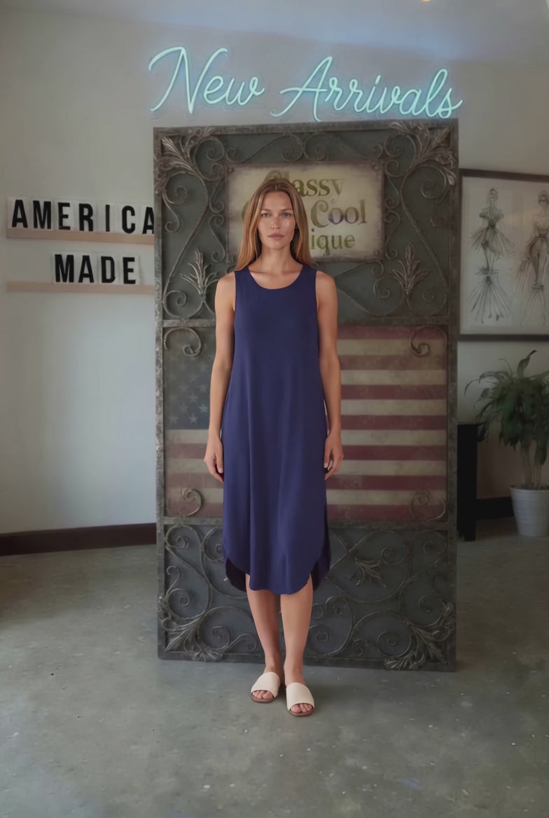 Sammie Sleeveless Midi Dress in navy blue. Relaxed fit, scoop neck, side pockets &amp; slits. 95% Rayon, 5% Spandex. Made in USA.