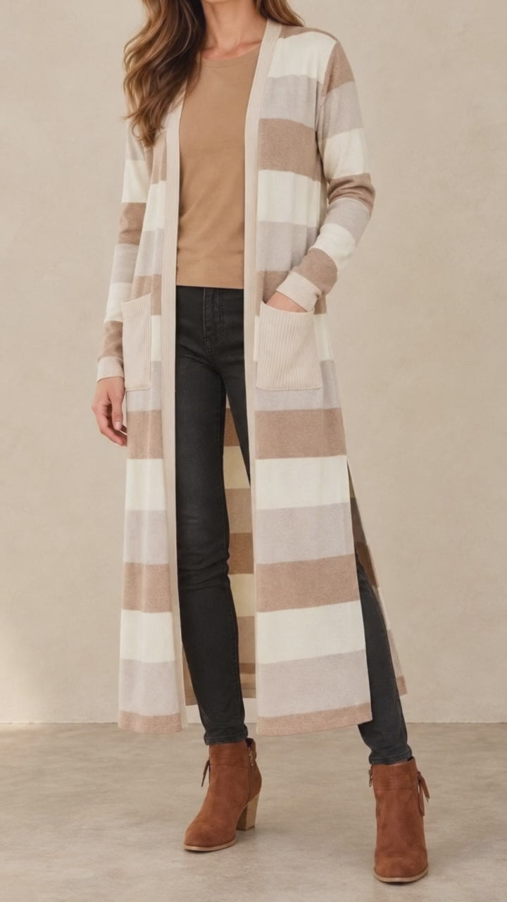 Woman wearing Made in USA the Lilian taupe striped longline cardigan with an open front, long sleeves, patch pockets and side slits for easy everyday layering.
