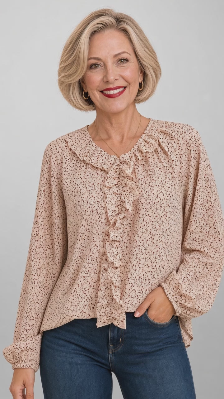 Made in USA. Renee brown or cream botanical print blouse with a ruffled V-neck, balloon sleeves and bubble hem. Lightweight woven style for casual or dressy days.