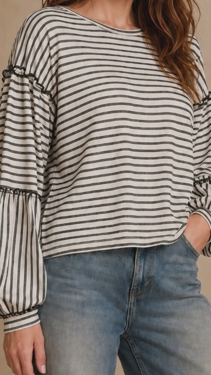 Made in USA. Tori textured striped top features stretch knit, tiered bubble sleeves and delicate ruffle trim. An easy everyday style in regular and plus sizes.