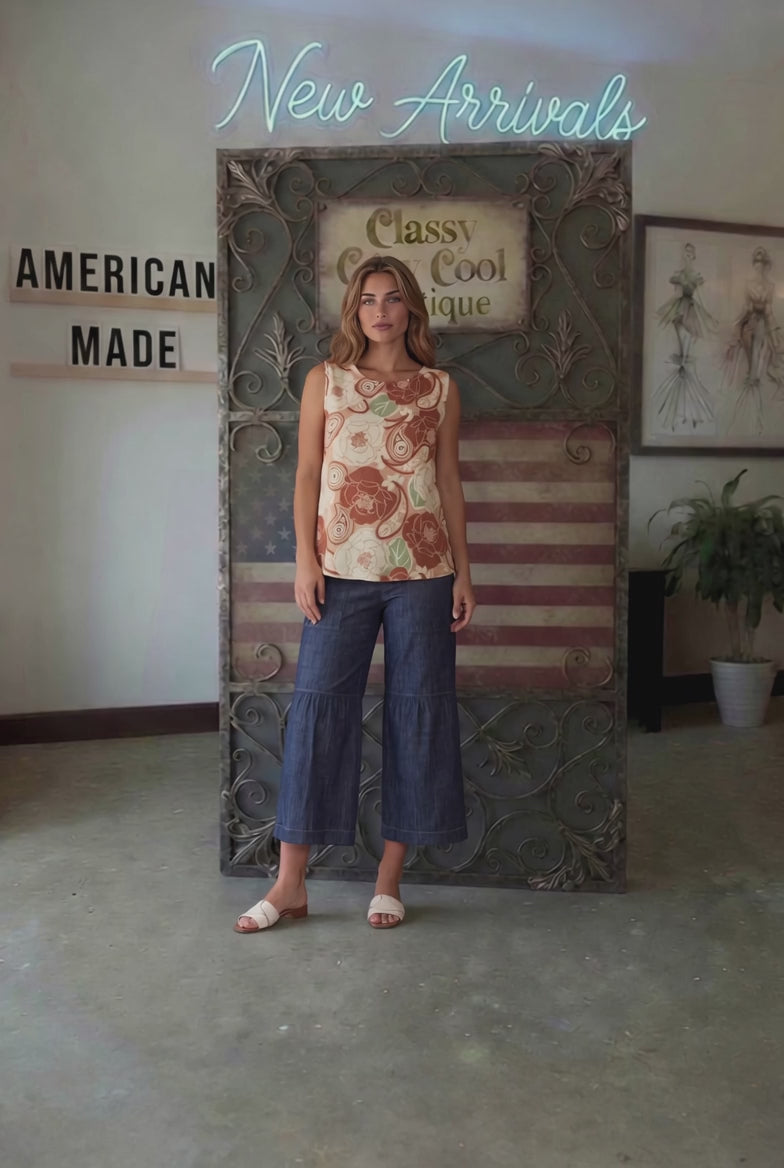 Sleeveless boat neck top in a rust floral paisley print. Hammered satin look, Rayon Linen Blend Fabric, longer in back. Made in USA.