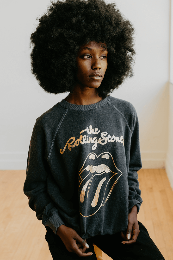 Plunge into the iconic age of rock with the Sticky Fingers Sweatshirt by the Rolling Stones. Composed of 50% organic cotton / 50% recycled polyester, this gender-neutral sweatshirt in a faded black shade is a salute to both the legendary band and eco-responsibility.