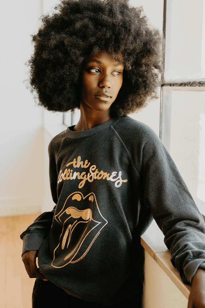 Plunge into the iconic age of rock with the Sticky Fingers Sweatshirt by the Rolling Stones. Composed of 50% organic cotton / 50% recycled polyester, this gender-neutral sweatshirt in a faded black shade is a salute to both the legendary band and eco-responsibility.