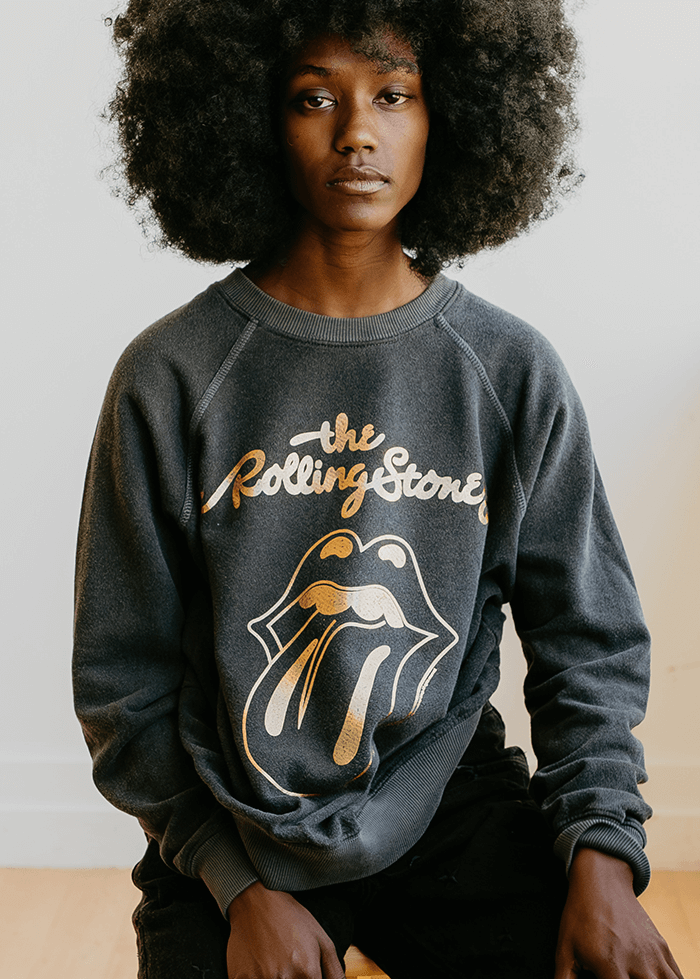 Plunge into the iconic age of rock with the Sticky Fingers Sweatshirt by the Rolling Stones. Composed of 50% organic cotton / 50% recycled polyester, this gender-neutral sweatshirt in a faded black shade is a salute to both the legendary band and eco-responsibility.
