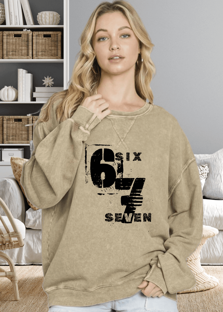 Oversized comfort meets effortless style with this Six Seven graphic top, crafted from premium USA cotton in a light-medium weight perfect for any season. The mineral-washed finish gives it that coveted lived-in look, while chunky sleeves and a round neck with subtle stitch detailing add personality to your everyday rotation.