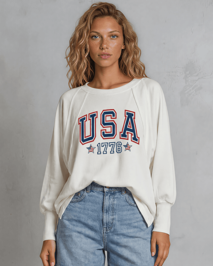 Bold USA 1776 varsity graphic on a soft oversized French terry sweatshirt. Made in USA, 88% cotton, dolman sleeves. Perfect for 4th of July &amp; everyday wear.
