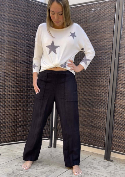 Proudly Made in USA, These Ladies 100% linen slouchy black pants are a spring & summer "Must-Have"! Frayed at Hem, Side Pockets, Baggy Fit | Classy Cozy Cool Women's Made in America Boutique