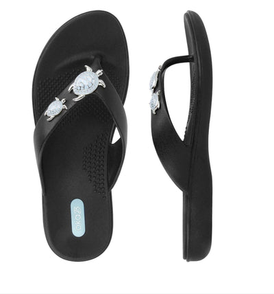 Oka-B Theresa Sea Turtle Sandals.  Made in the USA!  These adorable sandals will be a vacation for your feet.  The  aqua sea turtle decoration on these flip flops is so cute.  Available in White & Black.